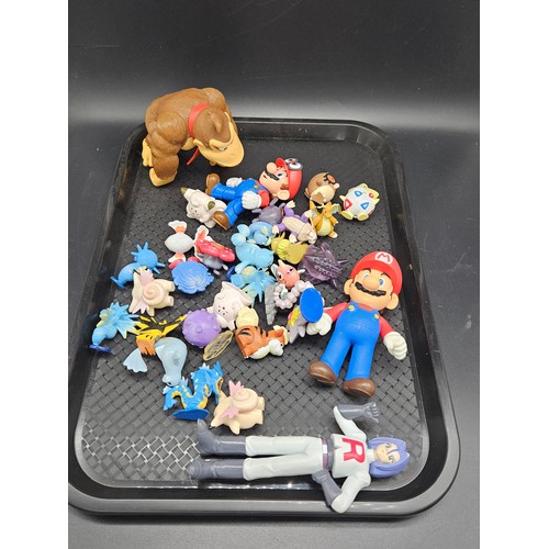 841 - A collection of vintage Pokémon cards and figures with some Mario figures