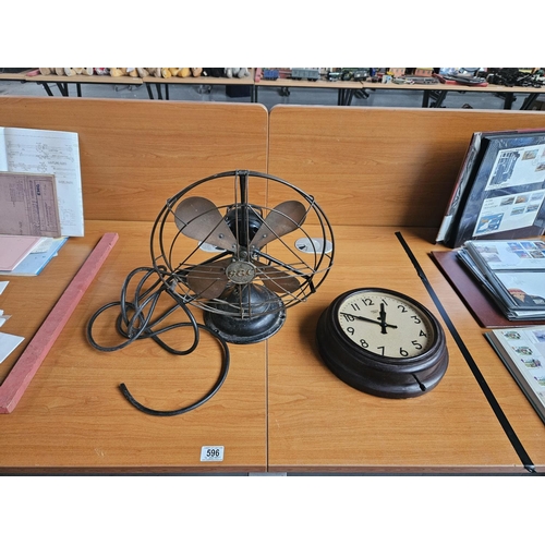 596 - An early G.E.C electric fan and a Smiths Bakelite school clock (electric) - both untested