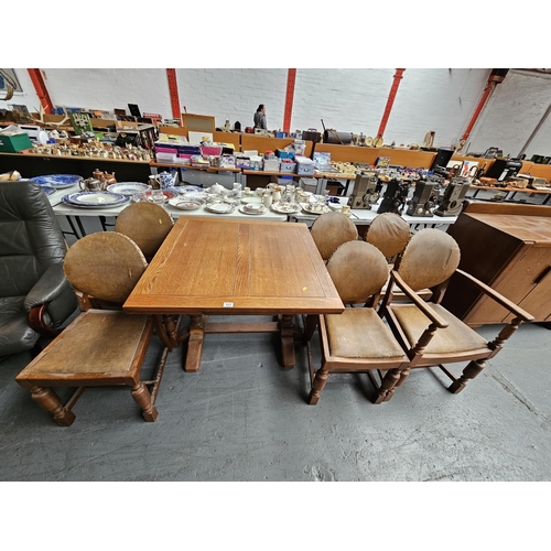 625 - An oak draw leaf extending dining table and six chairs