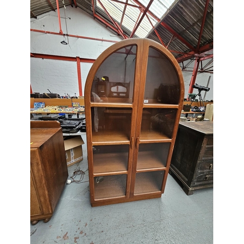 627 - A teak domed top display cabinet

Measurements: Height 180cm, Width 95cm, Depth 42cm