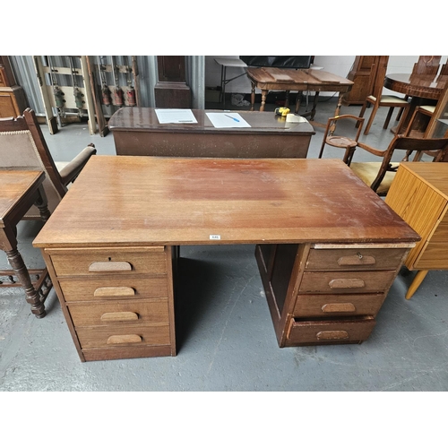 646 - A twin pedestal teak desk

Measurements: Height 74cm, Width 140cm, Depth 77cm