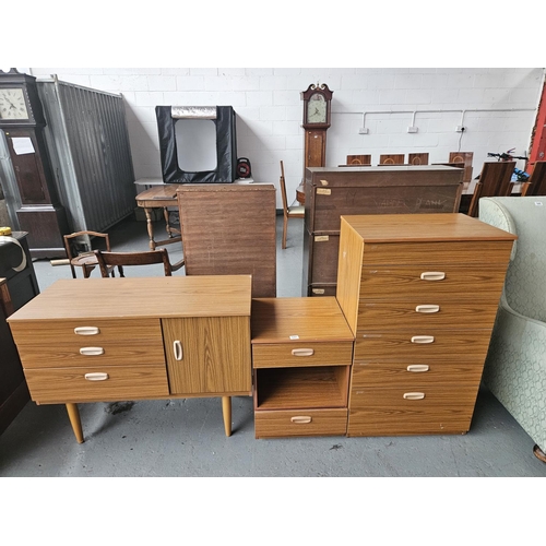 647 - A Schreiber sideboard, bedside cabinet and a chest of drawers