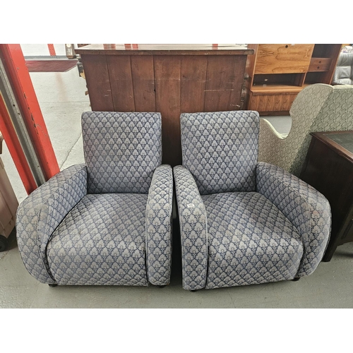 650 - A pair of upholstered Art Deco style armchairs