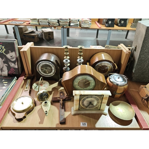 329 - Vintage items including mantle clocks, brass candlesticks, barometer, etc