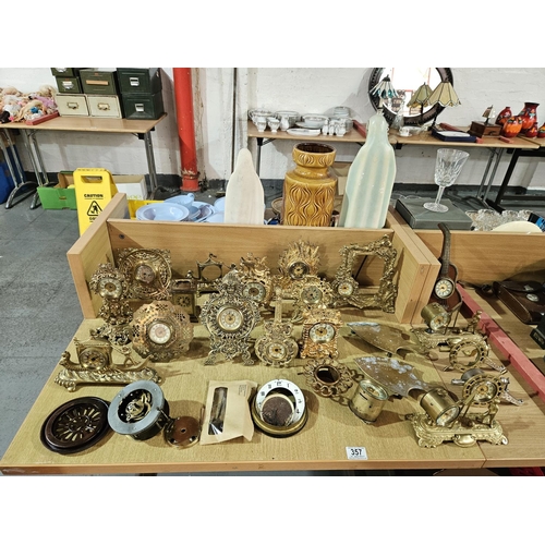 357 - A collection of brass clocks