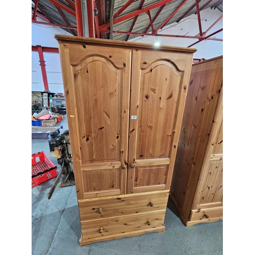 400 - A pine double wardrobe with two drawers

Measurements: Height 180cm, Width 86cm, Depth 54cm