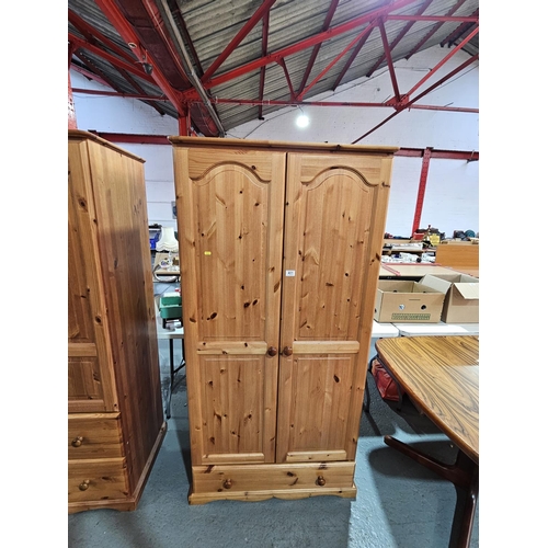 401 - A pine double wardrobe with single drawer

Measurements: Height 180cm, Width 86cm, Depth 54cm