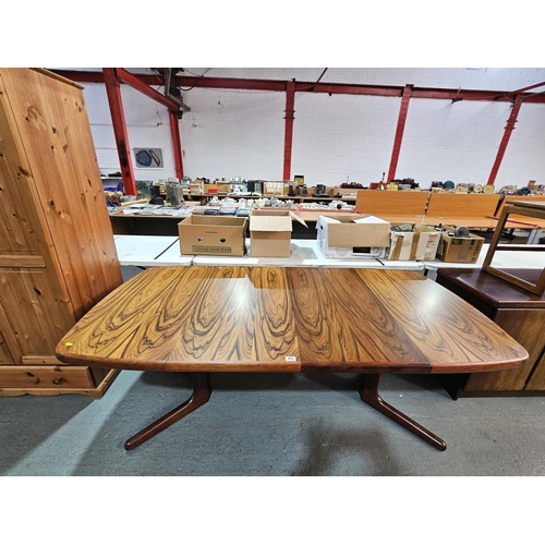 402 - A Skovby Danish rosewood extending dining table with two leaves

Measurements: Height 74cm, Width 10... 