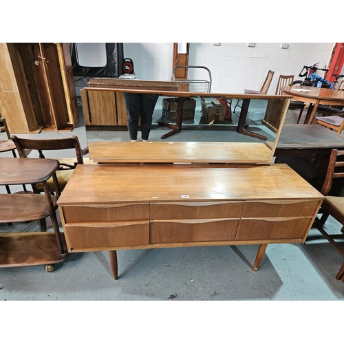 430 - A teak Austin Suite single mirror dressing table

Measurements: Height with mirror 114cm, Width 146c... 