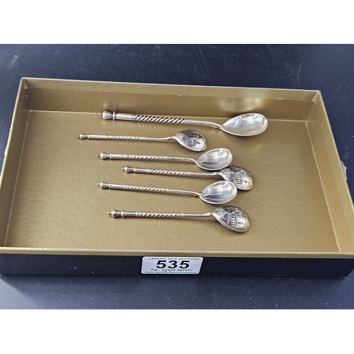 535 - A set of five matching Niello Russian silver teaspoons together with a larger one - each spoon decor... 