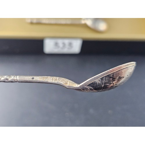 535 - A set of five matching Niello Russian silver teaspoons together with a larger one - each spoon decor... 