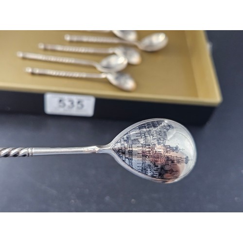 535 - A set of five matching Niello Russian silver teaspoons together with a larger one - each spoon decor... 