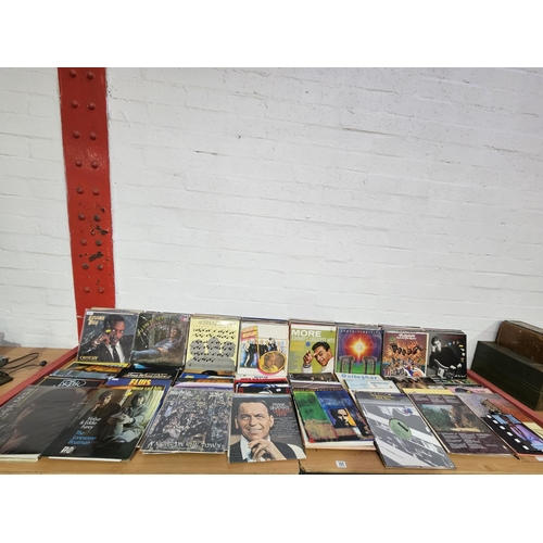 305 - A collection of vinyl records to include Earth, Wind & Fire, Elvis, Paul McCartney etc