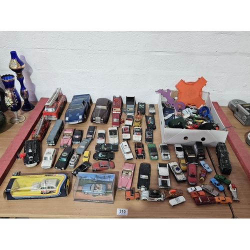 310 - A collection of mostly Dinky and Corgi playworn diecast cars