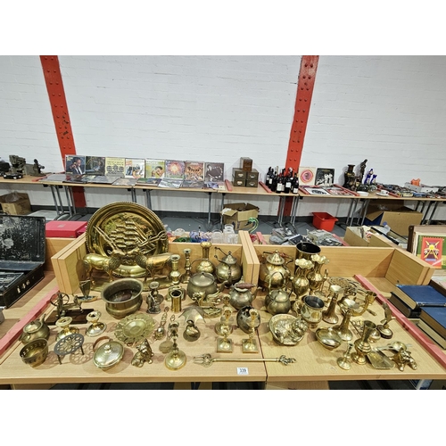 339 - A selection of brassware to include ornaments, candlesticks, kettles etc