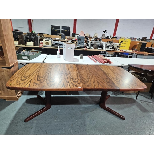 402 - A Skovby Danish rosewood extending dining table with two leaves

Measurements: Height 74cm, Width 10... 