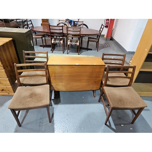 432 - A teak drop leaf dining table with four chairs