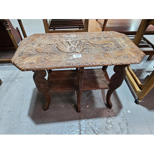 439 - A carved Indian table depicting buck and elephants
 25 inches x 14 inches x 19 inches tall