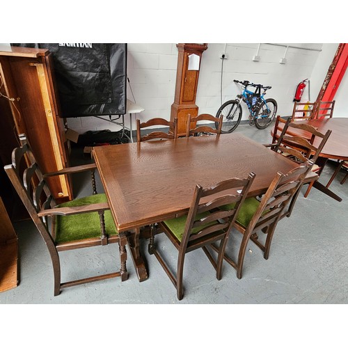 447 - An oak draw leaf dining table and six chairs