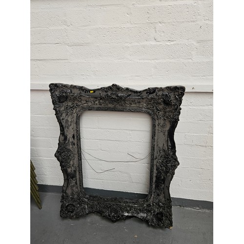 451 - A large ornate black picture frame

Measurements: Height 122cm, Width 102cm