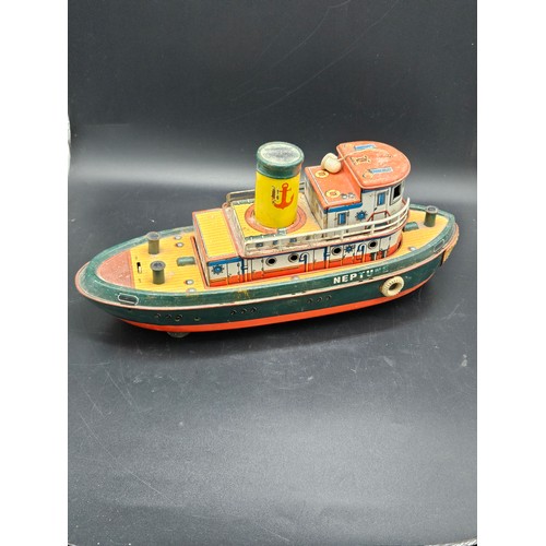 526 - A vintage tinplate Japanese model of a tug boat 