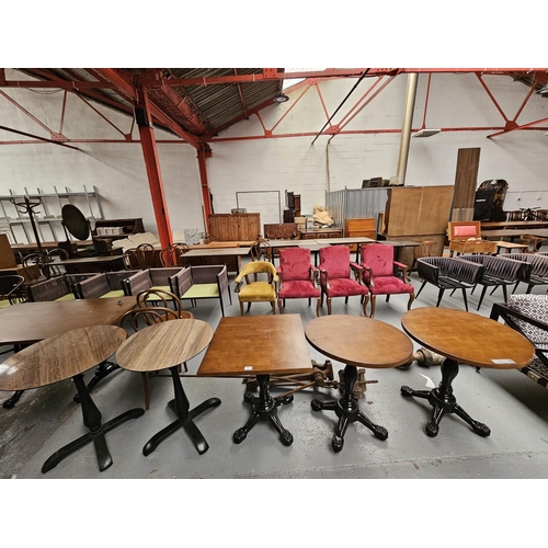 404 - Five modern pub/bistro tables with cast iron bases and four circular tops and one square wooden top