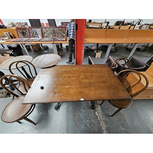 415 - Four Sandalyeci bentwood style chairs together with a cast iron base wooden top diding table