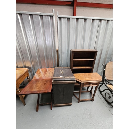 426 - An oak bookcase, side table, fold up occasional table and a trunk