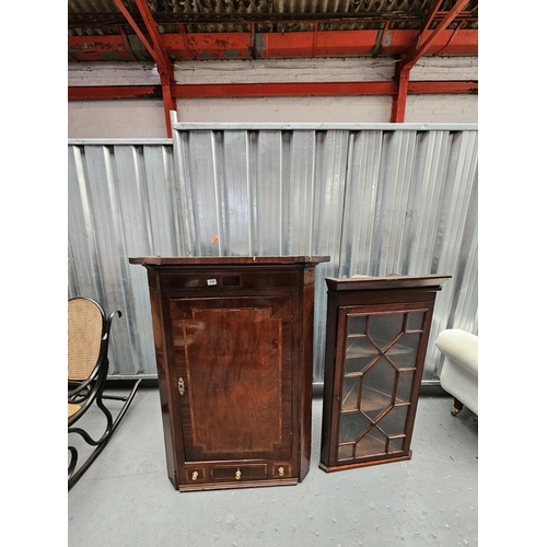 428 - Two wall hanging mahogany corner cabinets