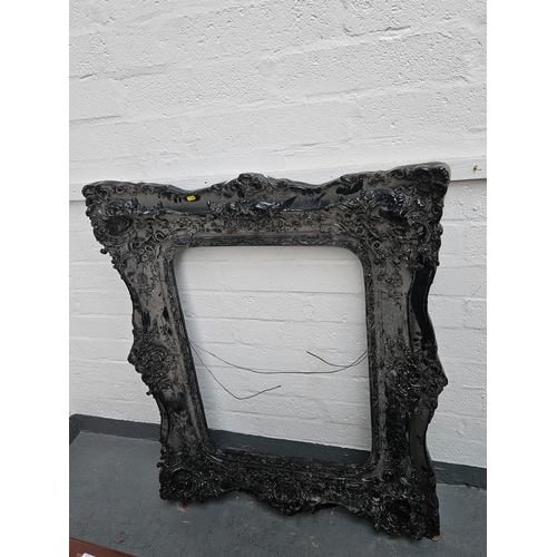 490 - A large ornate black picture frame

Measurements: Height 122cm, Width 102cm