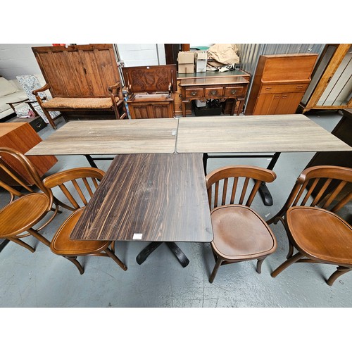 444A - Two Sandalyeci pub/bistro chairs together with a cast iron base wooden top pub/bistro table