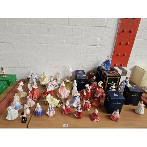 302 - Large quantity of Royal Doulton figurines including HN4898 Festive Wishes and other Christmas figure... 