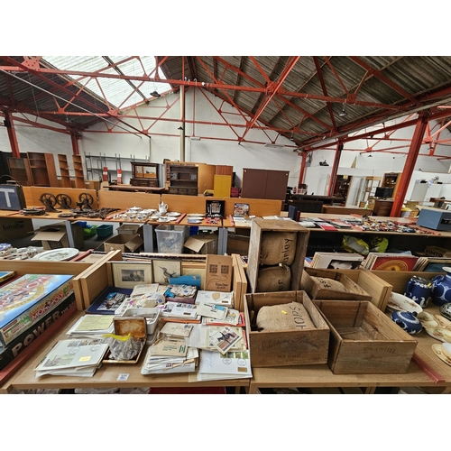 327 - Four wooden wine crates with hessian sacks together with coins, loose stamp and stamp albums e.t.c.