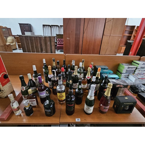 348 - A collection of alcohol to include shery, brandy, port e.t.c.