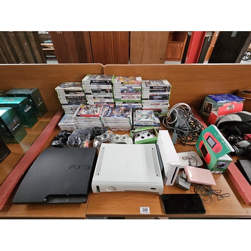 349 - A Playstation 3 console, Xbox 360 console and Wii console with an assortment of Xbox and Wii games