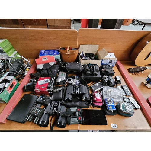 350 - A selection of Canon, Nikon, Fujifilm cameras together with binoculars, mobile phones e.t.c.