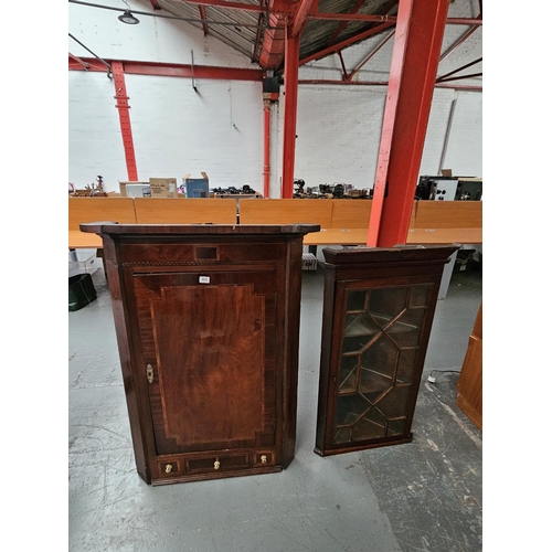 406 - Two wall hanging mahogany corner cabinets