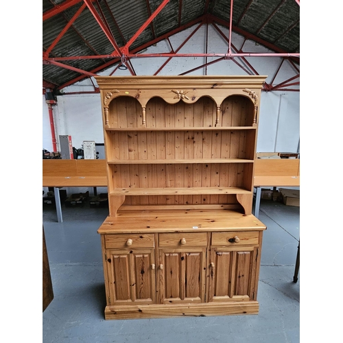 409 - A Pine dresser - top not attached to base.

H 205cm
W 136cm
D 48cm