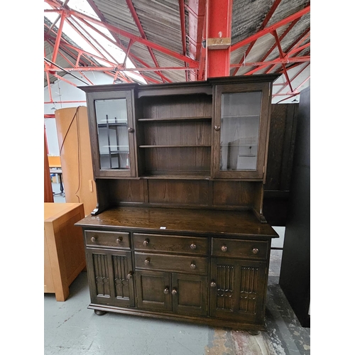 431 - A dark Ercol dresser

Height 199cm, Width 155cm, Depth 51cm