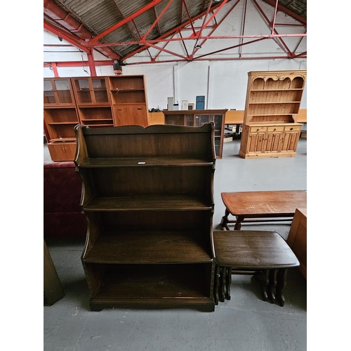 434 - A dark Ercol bookcase and nest of tables