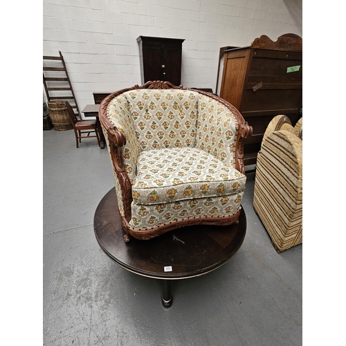 439 - A modern bowed back upholstered armchair together with a circular coffee table and a hostess/drinks ... 