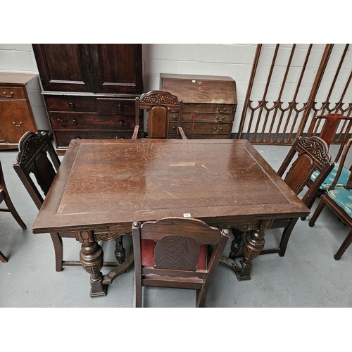 456 - An oak draw leaf dining table and four chairs