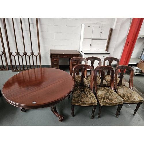 458 - A Victorian circular tilt top table and six chairs