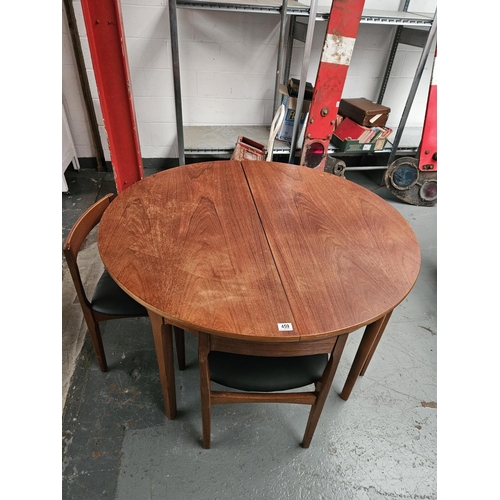 459 - A mid century Nathan extending dining table and 4 chairs