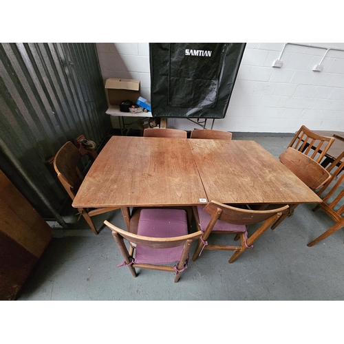 463 - A Nathan teak extending dining table and six chairs