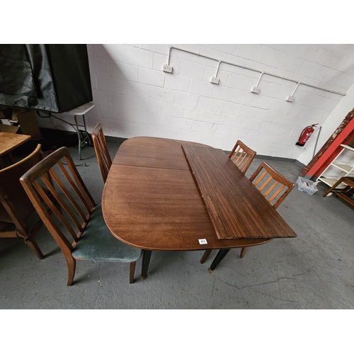 464 - A G Plan extending dining table together with 1 extra leaf and 4 chairs