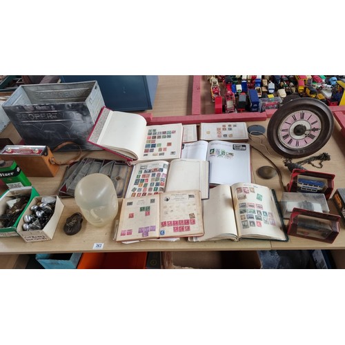 363 - Stamps in albums, an early clock, stained glass panels, Walls ice cream container and other vintage ... 