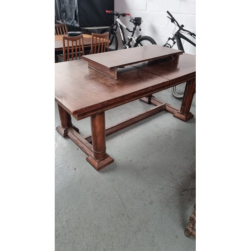 471 - An extending canon leg refectory dining table in mahogany