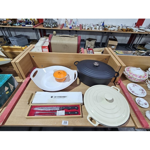 335 - A selection of Le Creuset and one other enamelled cast iron dish (cream pot)