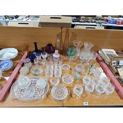 344 - A selection of art glass to include genie bottle (missing stopper), brandy glasses together with cut... 